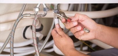 plumber fixing plumbing pipe